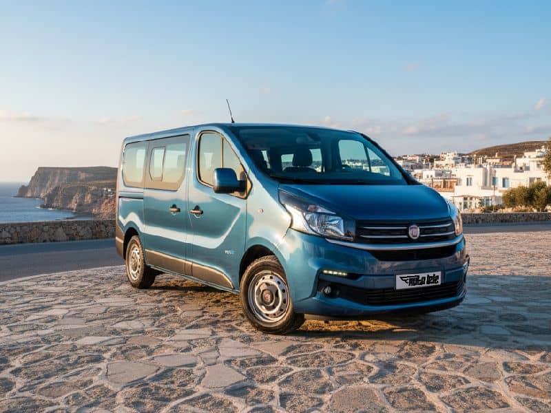 Rental minivan parked on a scenic coastal spot in Crete